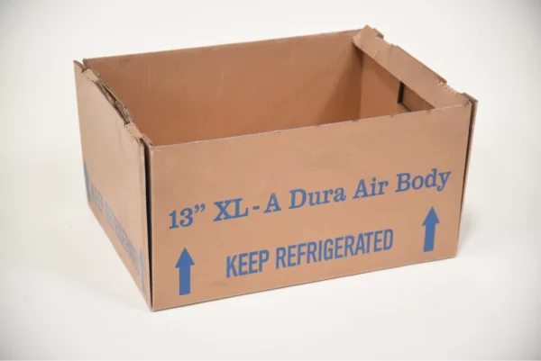 A close-up photo of a cardboard box with the words "13" XL-A Dura Air Body" and "KEEP REFRIGERATED" printed on the side.