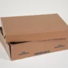 closed brown cardboard box with "KEEP REFRIGERATED" & "PERISHABLE" labels on the side