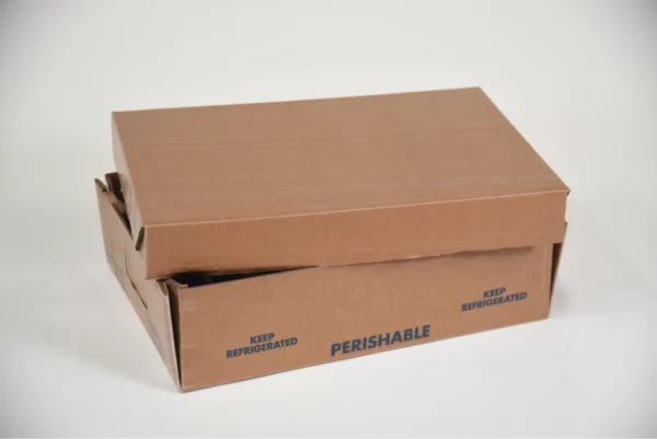 closed brown cardboard box with "KEEP REFRIGERATED" and "PERISHABLE" labels on the side, on a white background.