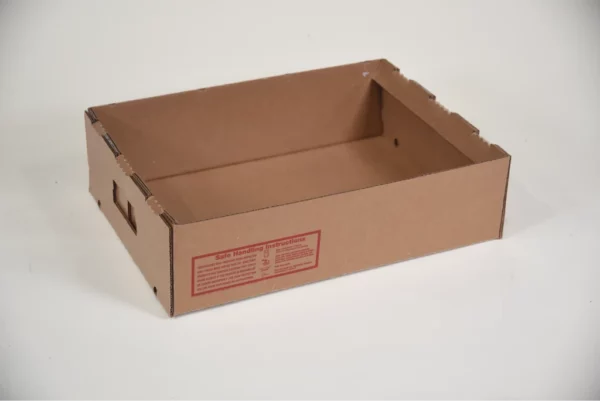 An open brown cardboard tray with a red informational label on one side, on a white background.